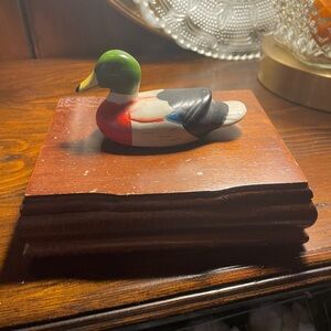 Colorful Duck Figurine on Wooden Base